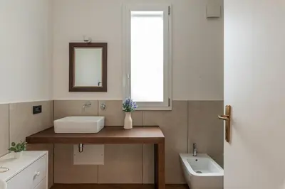 a bathroom with a sink and a mirror at Villa Giovanna con Piscina by Wonderful Italy in Castellammare del Golfo