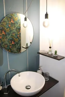 a bathroom with a white sink and a mirror at Porta delle Stelle Vucciria in Palermo