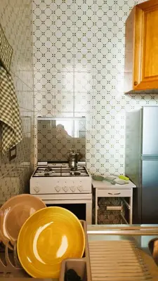 a kitchen with a stove and a plate on a table at Casa a Mare La Stalletta in Palermo