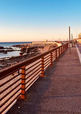a wooden fence on a beach with the ocean at Casa a Mare La Stalletta in Palermo