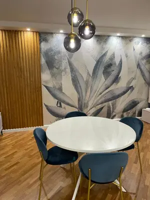 a meeting room with a white table and blue chairs at Baaria house in Bagheria