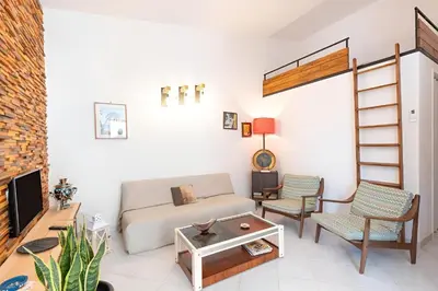 a living room with a couch and chairs at Casa Vacanze Maria in San Vito lo Capo