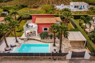 an aerial view of a house with a swimming pool at Villa Jacqueline con piscina privata 8 posti letto in Scopello