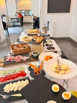 a long table filled with different types of food at 4 Canti Central Loft & Ground floor in Palermo