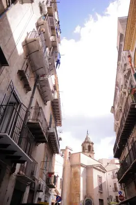 a view of a building with a clock tower at 4 Canti Central Loft & Ground floor in Palermo