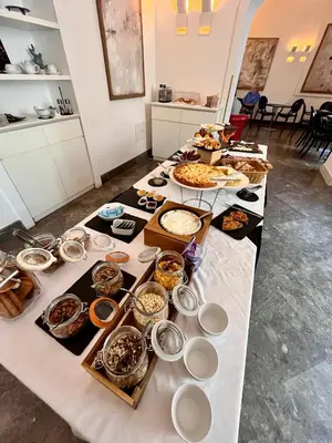 a long table with many different food items on it at 4 Canti Central Loft & Ground floor in Palermo