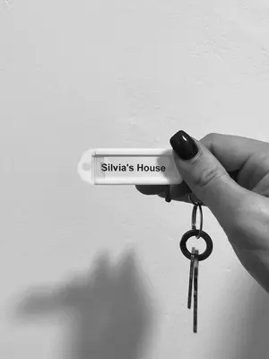 a person holding a pair of keys in their hand at Silvia's House in Castellammare del Golfo