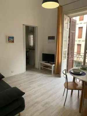 a living room with a couch and a table at A casa di Elvira in Palermo