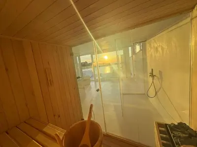 a bathroom with a shower with a glass door at Attico sul Mare - Suite & Spa in Palermo