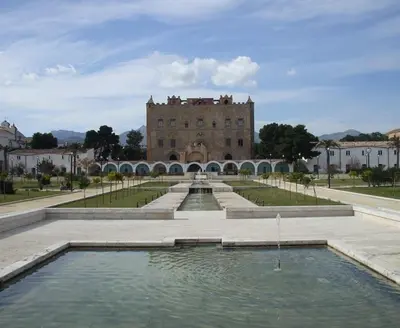 a building with a pool of water in front of a building at Vacanze Palermitane in Palermo