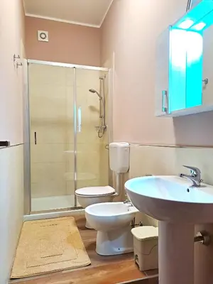 a bathroom with a toilet and a sink and a shower at La Finestra sul Golfo in Castellammare del Golfo