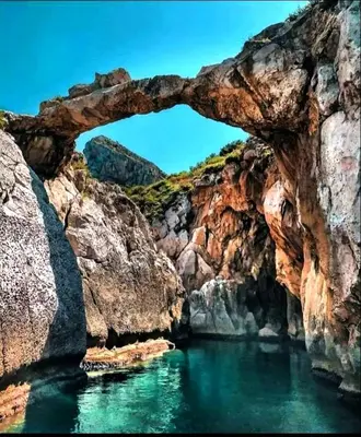 a natural bridge over a body of water at Bellavista in Santa Flavia