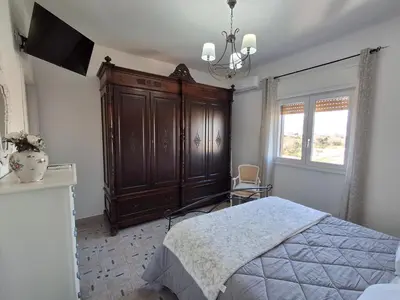 a bathroom with a white sink on a balcony at Ricky House in Palermo