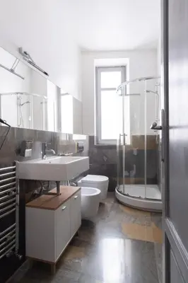 a bathroom with a sink and a shower and a toilet at ROME 118 intero appartamento in Palermo