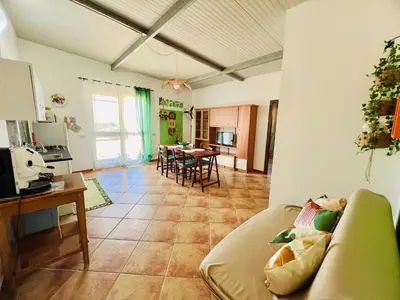 a living room with a couch and a table at Tri Ri Coppe in Cinisi