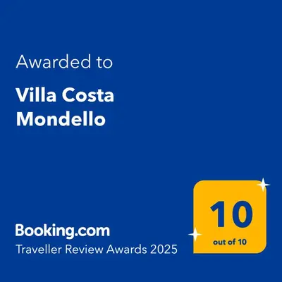a yellow sign with the text awarded to villa costa monolithic at Villa Costa Mondello in Palermo