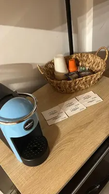 a kitchen counter with a toaster and a basket of towels at Calatafimi Rocca Home in Palermo
