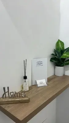 a shelf with scissors and a box on it at Calatafimi Rocca Home in Palermo