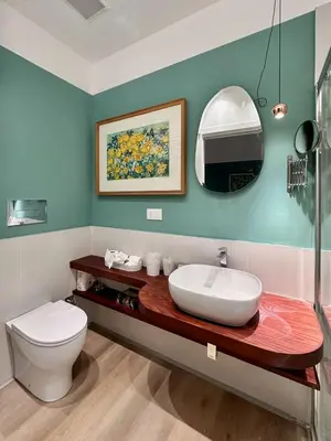 a bathroom with a sink and a toilet at La Nica in Palermo