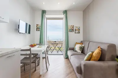 a living room with a couch and a table at Sant'Erasmo luxury home in Palermo