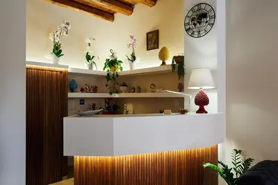a room with shelves with vases on the wall at Trinacria Caccamo - Luxury Rooms in Caccamo