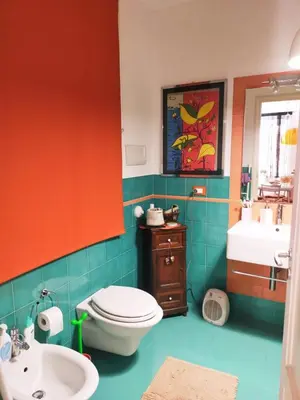 a bathroom with a toilet and a sink at Casa Anita In centro in Palermo