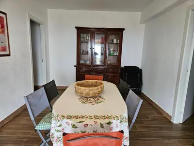 a dining room with a table with a basket on it at La Terrazza Bella Vista in Castellammare del Golfo