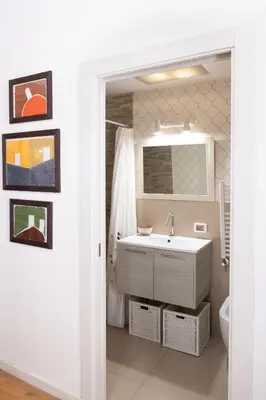a bathroom with a sink and a mirror at La Cecia Home in Castellammare del Golfo