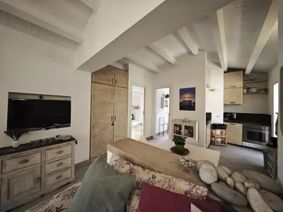 a large living room with a couch and a tv at Chalet Tango in Contrada Sauci Grande