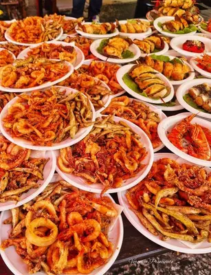 a bunch of plates of food on a table at Maison al-Aziz in Palermo