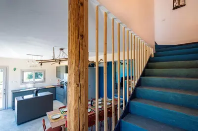 a staircase in a house with blue stairs at Villa Maguetta with private pool in Scopello in Scopello