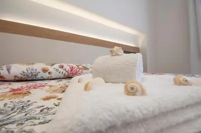 a cake on top of a bed in a room at Un tocco di San Vito in San Vito lo Capo