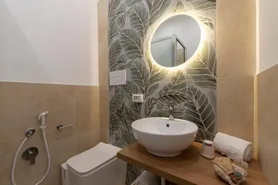 a bathroom with a sink and a mirror at Un tocco di San Vito in San Vito lo Capo
