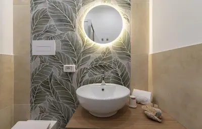 a bathroom with a sink and a mirror at Un tocco di San Vito in San Vito lo Capo