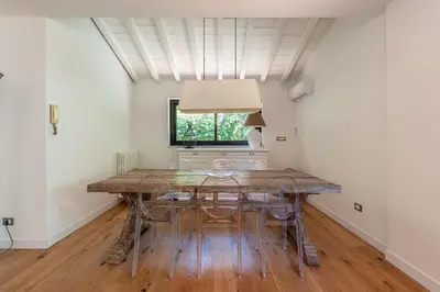 a dining room with a table and a window at Villa Nika in Palermo