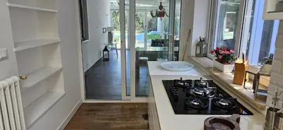 a kitchen with a stove and a counter top at Villa Nika in Palermo