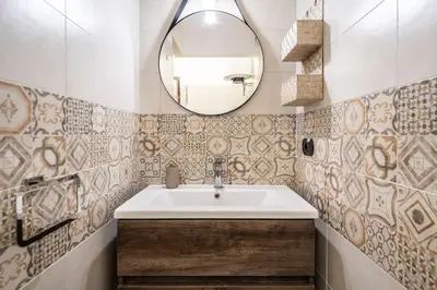 a bathroom with a sink and a mirror at [MoroHouse] 50mt from Teatro Massimo in Palermo