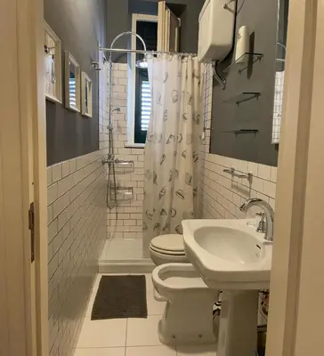 a bathroom with a toilet and a sink at Appartamento Vento D'Estate in Bagheria