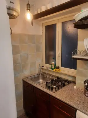 a kitchen with a sink and a stove at EMILY'S HOUSE in Palermo