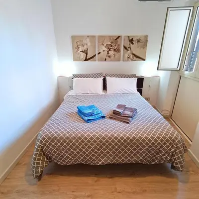a bedroom with a bed with two books on it at [CENTRO STORICO] Casa Bellini ***** in Palermo