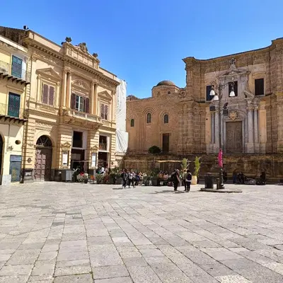 a group of people walking in a plaza in front of a building at [CENTRO STORICO] Casa Bellini ***** in Palermo