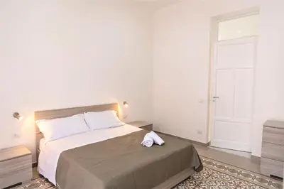 a bedroom with a bed with a towel on it at Casa Vacanze Deianira in Santa Flavia