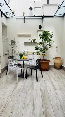 a dining room with a table and chairs at Casa Vacanze Donna MariaCarme' in Palermo