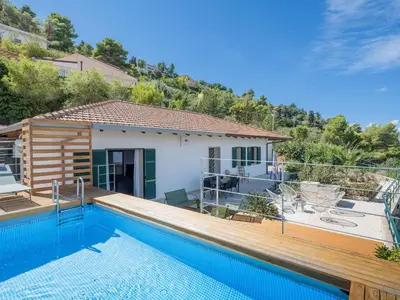 a villa with a swimming pool and a house at Villa Moon Total Relax in Alcamo