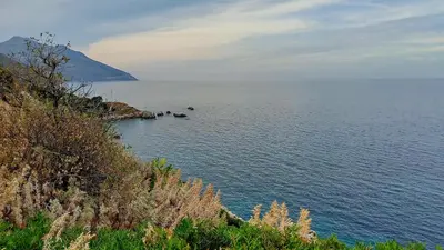 a large body of water with rocks in it at Vista sul mare e splendido terrazzo in Castellammare del Golfo