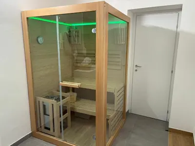 a wooden cabinet with glass doors in a room at Luna Marie in Palermo