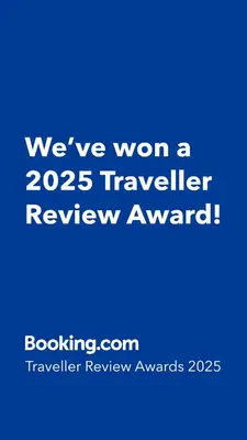 a blue sign that says weve won a traveler review award at Luna Marie in Palermo