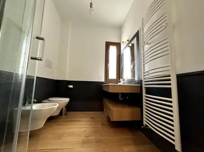 a bathroom with a tub and a sink and a toilet at Casa sul Mare alle porte di Palermo in Isola delle Femmine