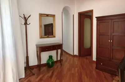 a room with a table and a mirror on the wall at Capo Seralcadio in Palermo