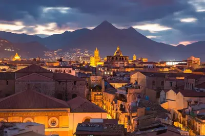a view of a city with mountains in the background at Capo Seralcadio in Palermo